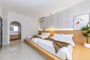 Katil atau katil-katil dalam bilik di Meizhou Island Diary Bed and Breakfast