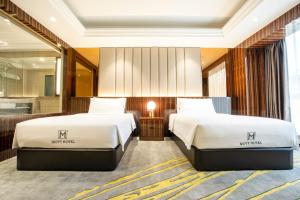 Postel nebo postele na pokoji v ubytování Moty Hotel
