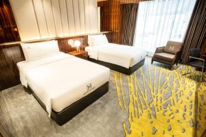 Postel nebo postele na pokoji v ubytování Moty Hotel