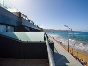 a view of the ocean from a building at Sercotel Playa Canteras in Las Palmas de Gran Canaria