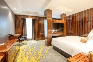 Postel nebo postele na pokoji v ubytování Moty Hotel