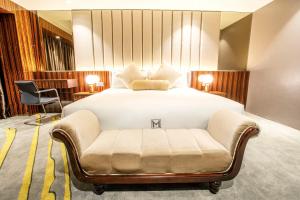 Postel nebo postele na pokoji v ubytování Moty Hotel