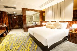 Postel nebo postele na pokoji v ubytování Moty Hotel