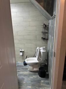 a bathroom with a toilet in a bathroom stall at BlackSeaAp in Kobuleti +8 photos