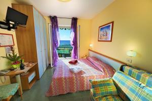 Cama ou camas em um quarto em Hotel Lucerna
