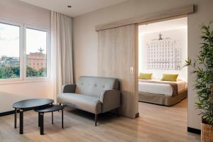 A bed or beds in a room at Sercotel Hotel Parque