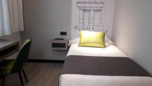 A bed or beds in a room at Sercotel Hotel Parque