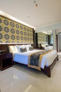 Puri Santrian Beach Resort And Spa客房内的一张或多张床位
