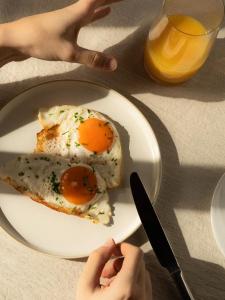 a plate of food with an egg on it at Gästehaus Freitag das kleine Hotel in Sankt Georgen +4 photos