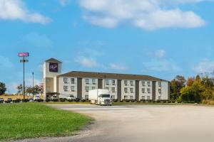a truck parked in front of a large building at Sleep Inn Athens I-65 in Athens
