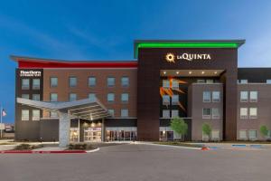 a rendering of the front of a hotel at La Quinta Inn & Suites by Wyndham DeSoto in DeSoto