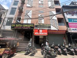 a group of motorcycles parked in front of a building at Super Hotel O High Sky in New Delhi