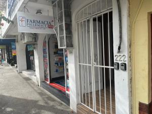 a store with a sign on the side of a building at La Puerta Blanca #5 in Puerto Vallarta