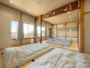 Postel nebo postele na pokoji v ubytování Mageme House JUN-CB0102