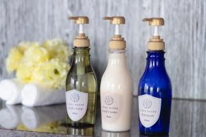 three bottles of milk and soy sauce on a counter at Centurion Hotel Ueno in Tokyo