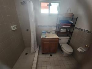 a bathroom with a sink and a toilet and a window at Casa mexicana in San Felipe +19 photos