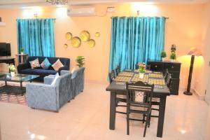 a living room with a couch and a table at 2nd Innings Calangute Private in Calangute