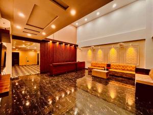 a large room with a pewsasteryasteryasteryasteryasteryasteryasteryasteryastery at Hotel The Meridian, Near Har Ke Pauri Road - Haridwar in Haridwār