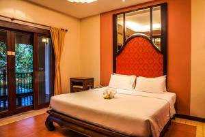 Postel nebo postele na pokoji v ubytování Suuko Villas