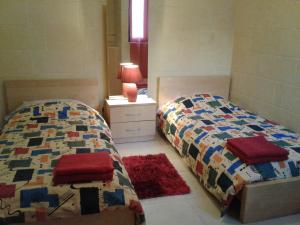 Postel nebo postele na pokoji v ubytování Apartment With Pool Gozo