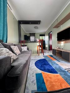 Ένα ή περισσότερα κρεβάτια σε δωμάτιο στο Home stays by Zulia - Buziga