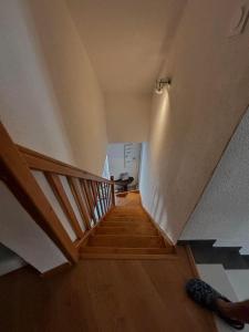 a person is walking down a staircase in a house at Chic et relax familial in Montmarault