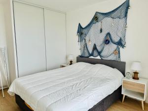 Postel nebo postele na pokoji v ubytování Face à la mer immense