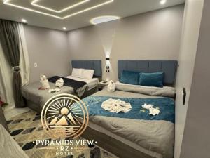 Krevet ili kreveti u jedinici u objektu Pyramids View R Z Hotel