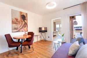 a living room with a couch and a table at Apartments Casa Barbara in Rab
