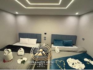 Krevet ili kreveti u jedinici u objektu Pyramids View R Z Hotel