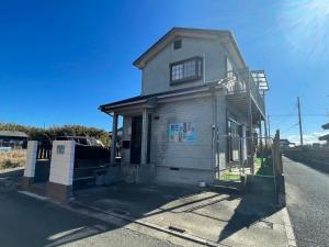 a house on the side of a street at Pets OK! Close to the sea! Starlit House with a dog run AC8 in Hasunuma