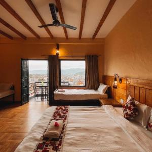 Ein Bett oder Betten in einem Zimmer der Unterkunft Hotel Tourist Residency