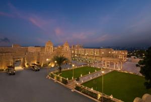a large building with a courtyard with lights in front at Storii By ITC Hotels, Jaisalmer in Jaisalmer