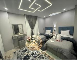 Krevet ili kreveti u jedinici u objektu Pyramids View R Z Hotel