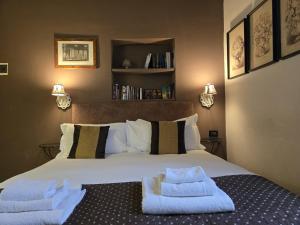 Postel nebo postele na pokoji v ubytování B&B Cimatori