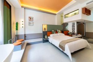 Vishan Keys Hotel 维尚潮宿客房内的一张或多张床位