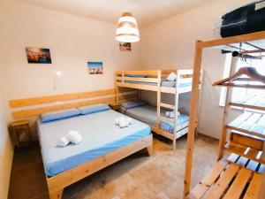 Posteľ alebo postele v izbe v ubytovaní il borghetto in valle d'itria