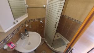 a bathroom with a toilet and a sink and a shower at Rooms Beba in Herceg-Novi