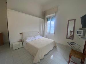 TV a/nebo společenská místnost v ubytování Hotel Vietri Coast