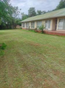an empty yard in front of a house at Tumelos Place in Bloemfontein