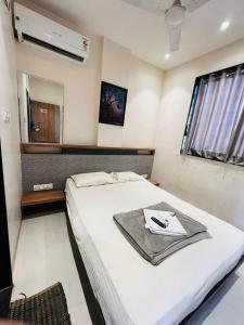Postel nebo postele na pokoji v ubytování Hotel Pragati Inn