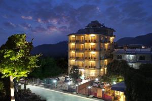 a large building with lights on at night at Pokhara Choice Inn in Pokhara