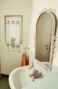 a bathroom with a sink and a mirror at Casalago in Domaso