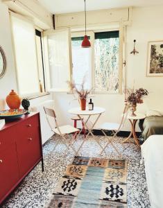 a living room with a table and a couch at Casalago in Domaso