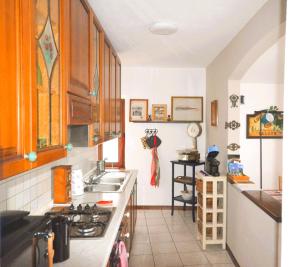 a kitchen with a sink and a counter top at Casa Ginny in Orta San Giulio