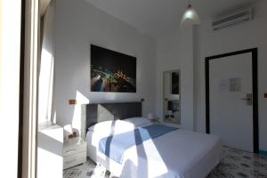 Postel nebo postele na pokoji v ubytování Hotel Vietri Coast
