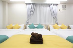 Letto o letti in una camera di LUANA in KOUENJI