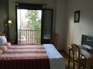 Posteľ alebo postele v izbe v ubytovaní Hotel Cinco Castaños