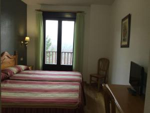 Posteľ alebo postele v izbe v ubytovaní Hotel Cinco Castaños
