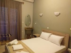 Кровать или кровати в номере Hotel Isidora